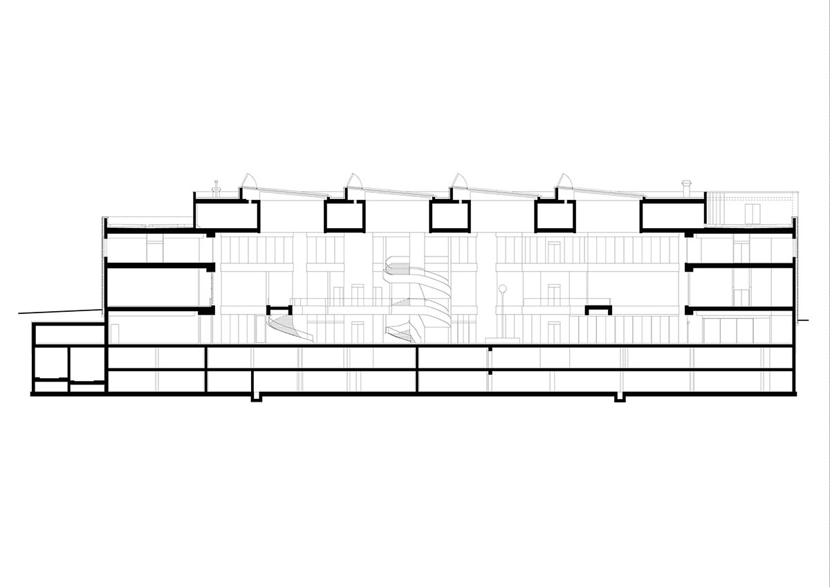 Cascading walkways wrap a vast atrium at Lindt Home of Chocolate designed by Christ & Gantenbein