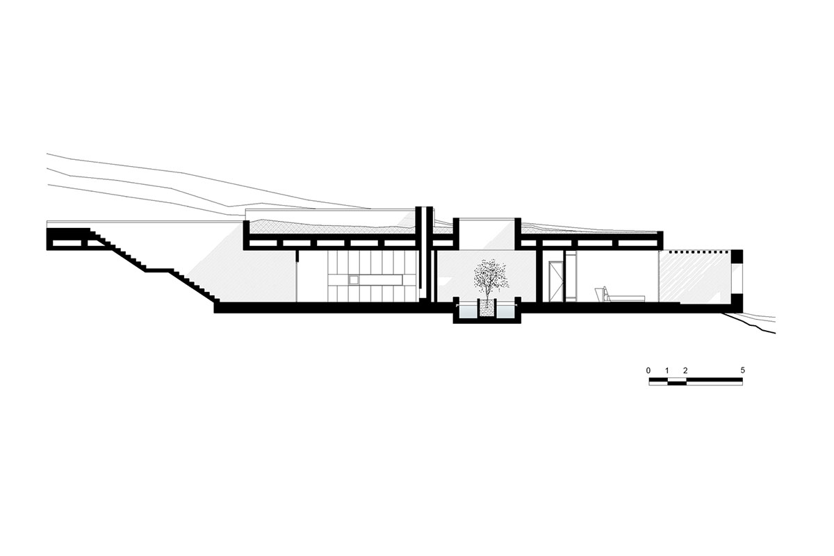 Swimming pool is bravely extended from inside of this concrete house towards endless view in Tinos