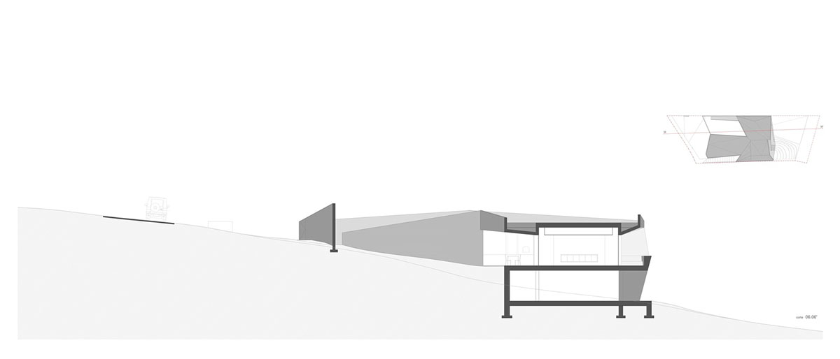Contaminar Arquitectos built cave-like house from irregular walls inspired by rocky topography