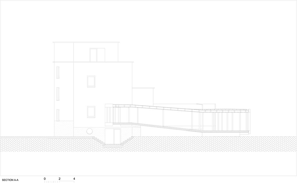 OFIS Architects renovates 1930s house with colonnaded and sloped pavilion in Slovenia 