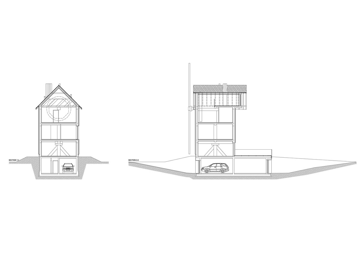 Michał Kucharski and o4 architekci clad old windmill with charred wood in a Polish town 