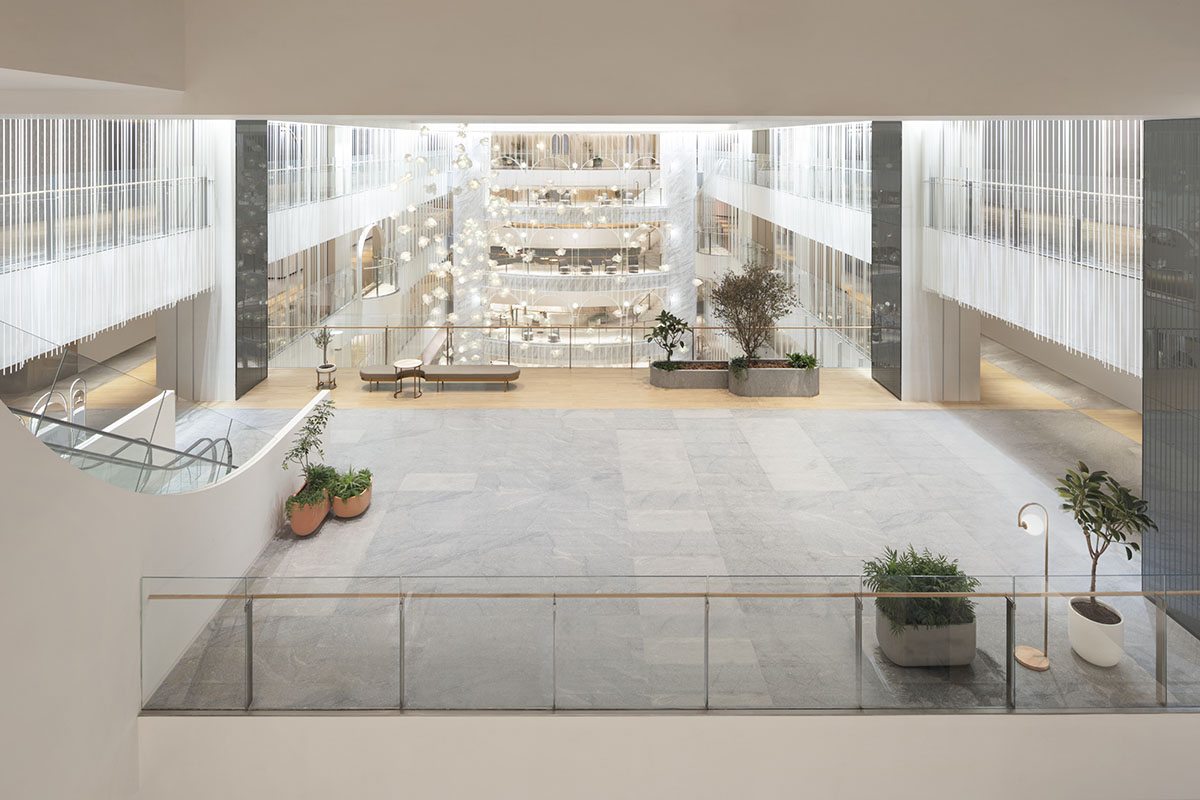 Nendo revives old Shanghai Times Square with aluminum screen that percolates on the facade