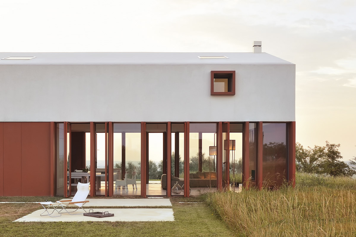 White and reddish strips are used to create cinematic appearance for Border Crossing House in Italy