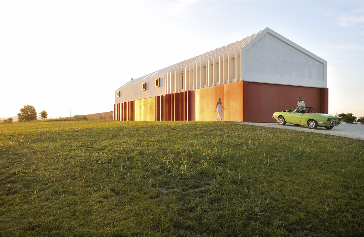 White and reddish strips are used to create cinematic appearance for Border Crossing House in Italy