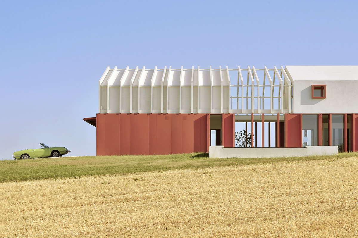 White and reddish strips are used to create cinematic appearance for Border Crossing House in Italy