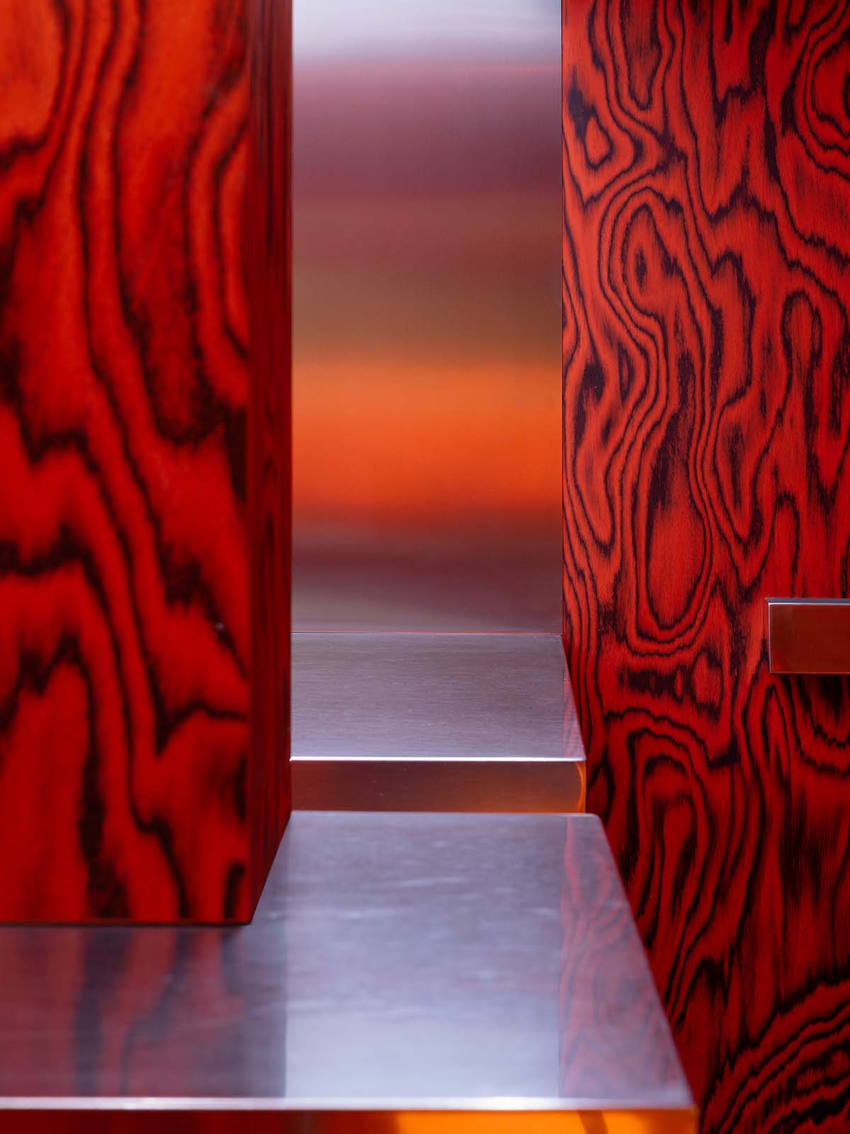 Bold red and black surfaces dominate the interior of the Oven Club, designed by Clap Studio