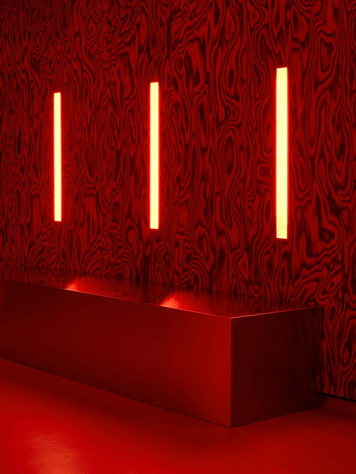 Bold red and black surfaces dominate the interior of the Oven Club, designed by Clap Studio