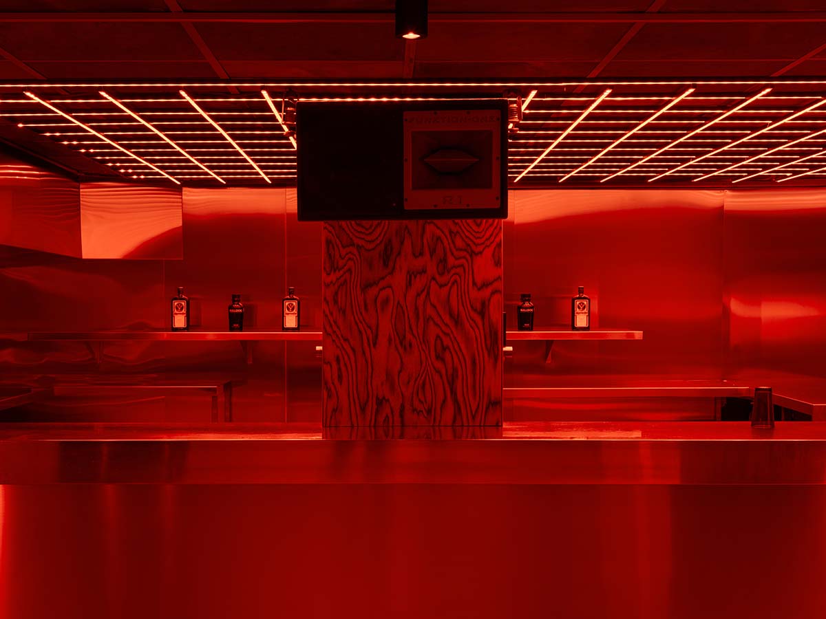 Bold red and black surfaces dominate the interior of the Oven Club, designed by Clap Studio