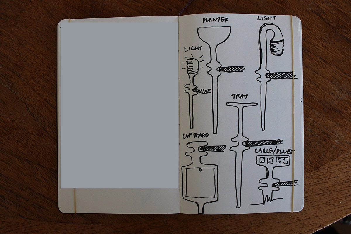 Heatherwick Studio designs glass desk supported by sculptural planter legs