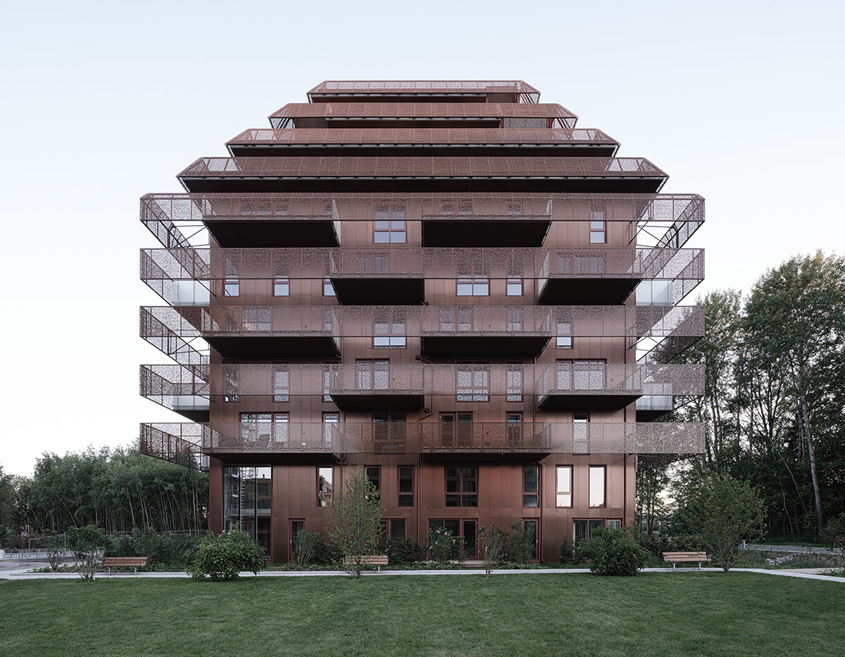Reiulf Ramstad Arkitekter completes copper Ski Tårn housing wrapped in linear terraces in Norway