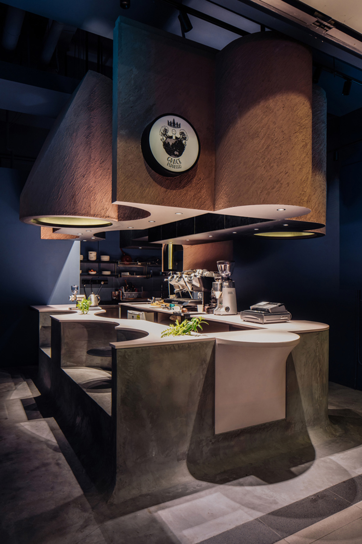 Studio SKLIM creates punctuated spaces and circular geometries to form this cafe in Singapore