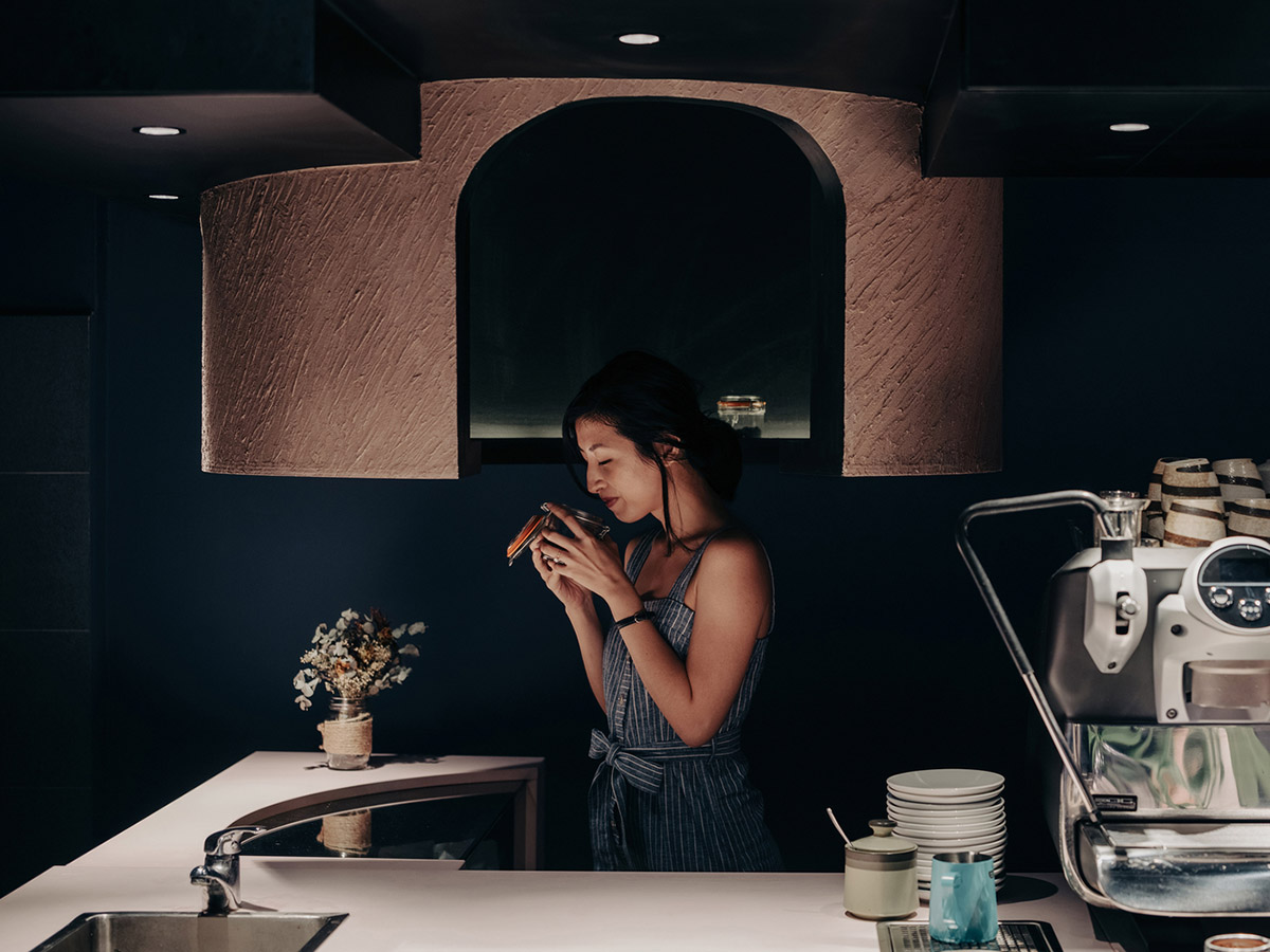 Studio SKLIM creates punctuated spaces and circular geometries to form this cafe in Singapore