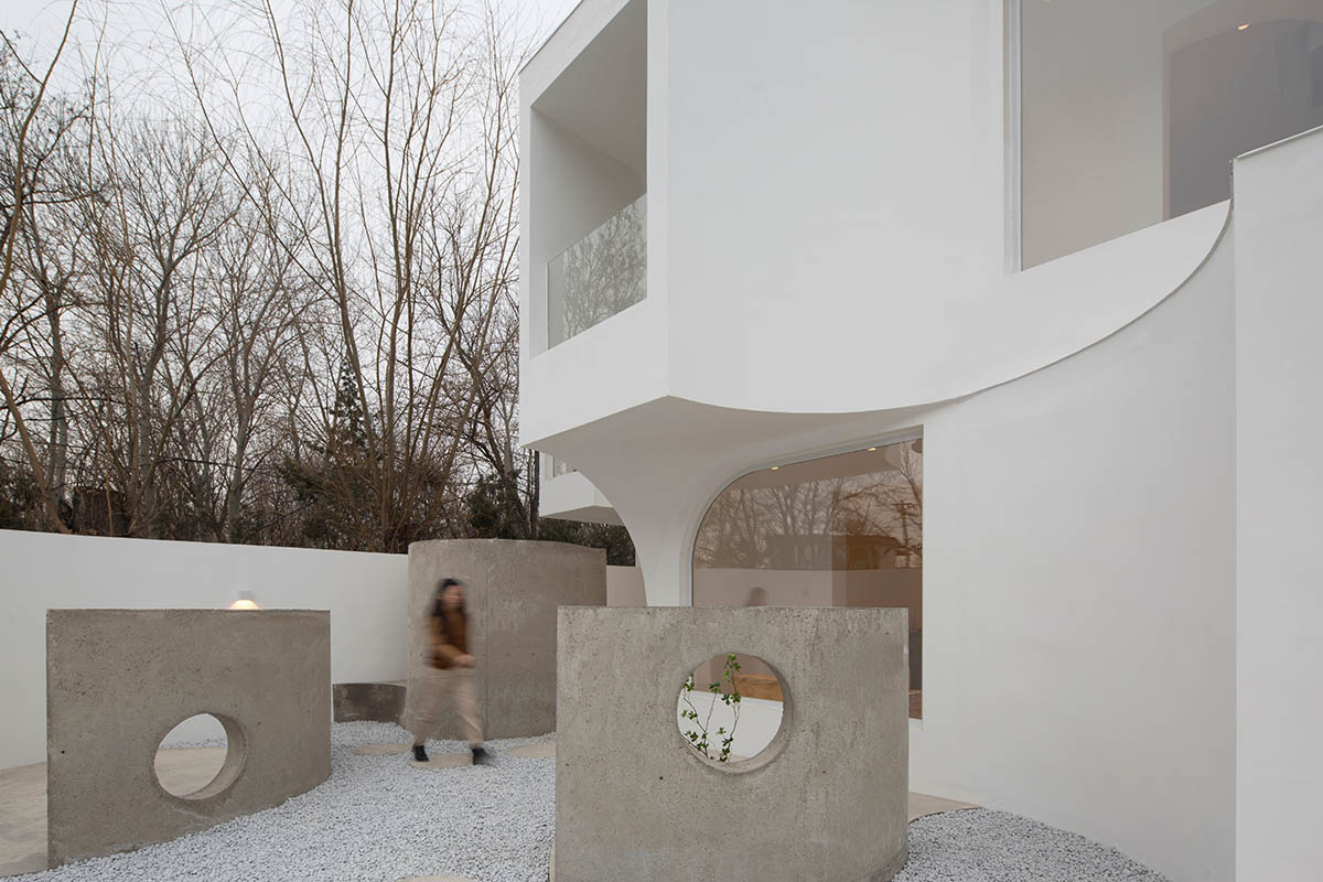 Boutique hotel by Atelier d'More is shaped by flowing curves and sculptural geometric compositions