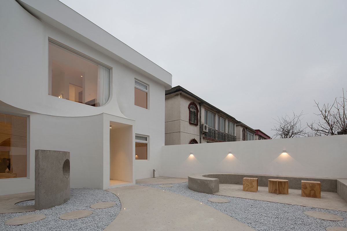 Boutique hotel by Atelier d'More is shaped by flowing curves and sculptural geometric compositions