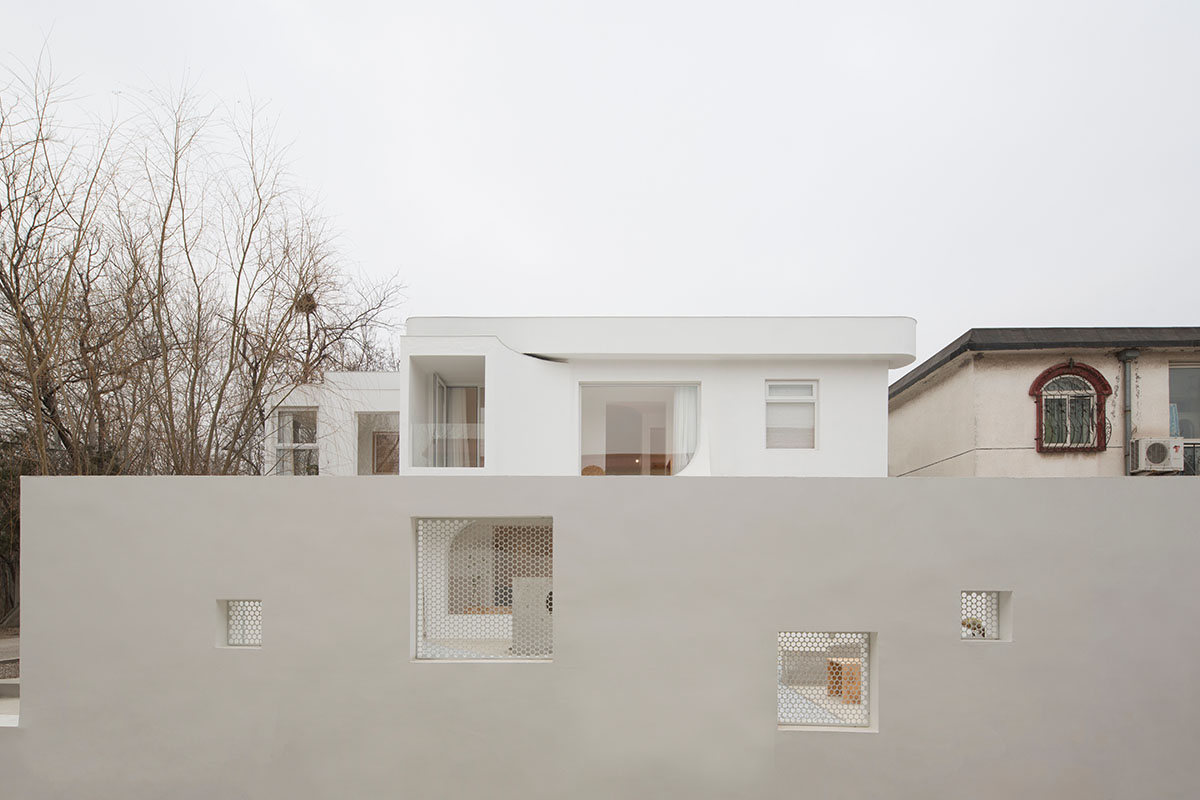 Boutique hotel by Atelier d'More is shaped by flowing curves and sculptural geometric compositions