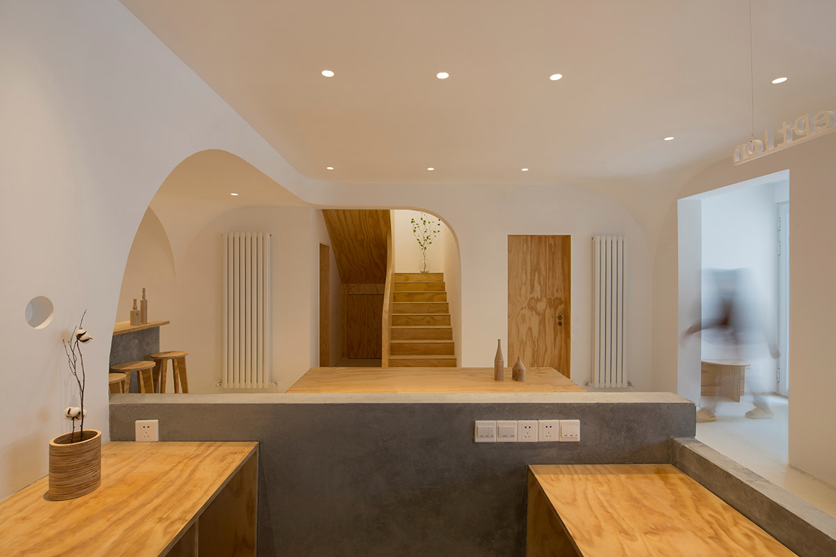 Boutique hotel by Atelier d'More is shaped by flowing curves and sculptural geometric compositions