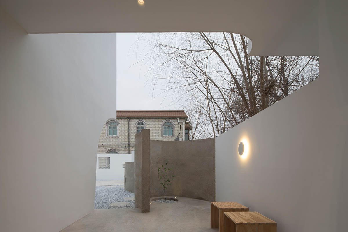 Boutique hotel by Atelier d'More is shaped by flowing curves and sculptural geometric compositions