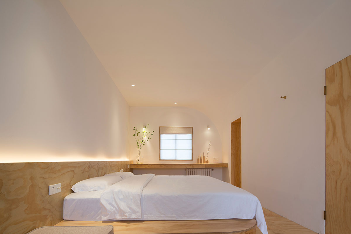 Boutique hotel by Atelier d'More is shaped by flowing curves and sculptural geometric compositions