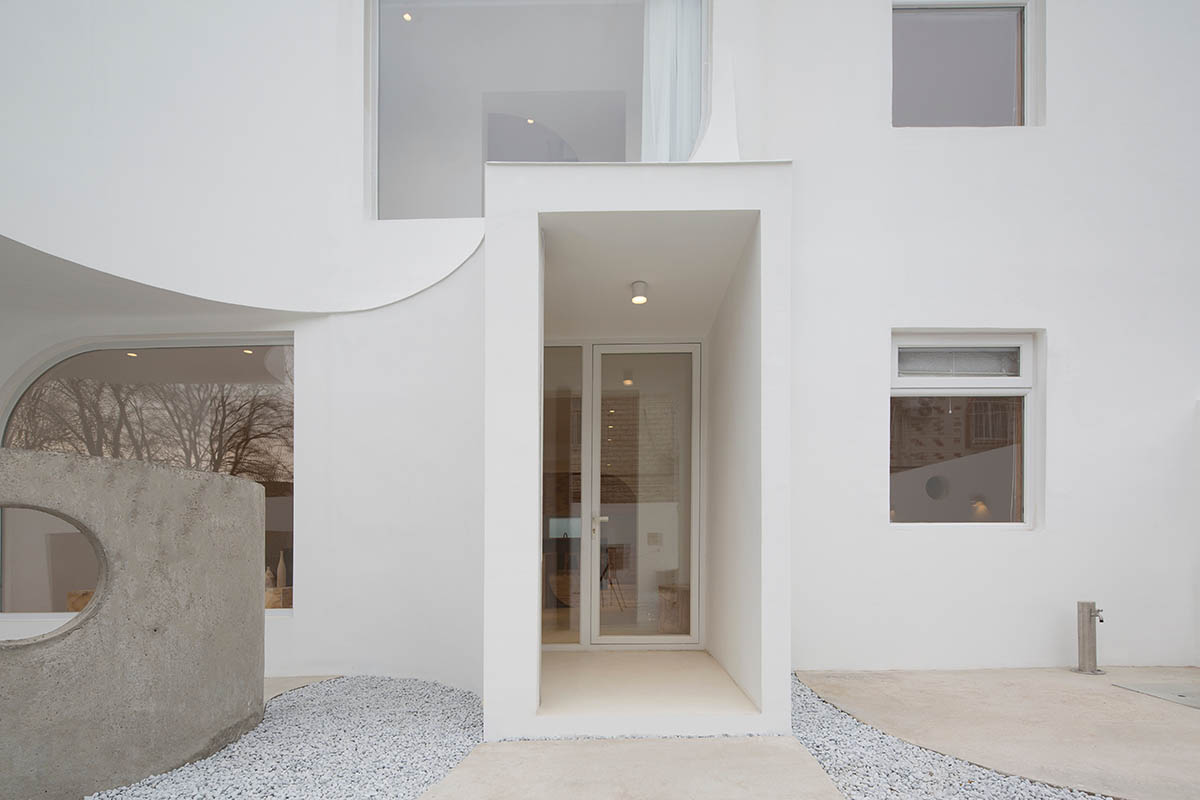 Boutique hotel by Atelier d'More is shaped by flowing curves and sculptural geometric compositions