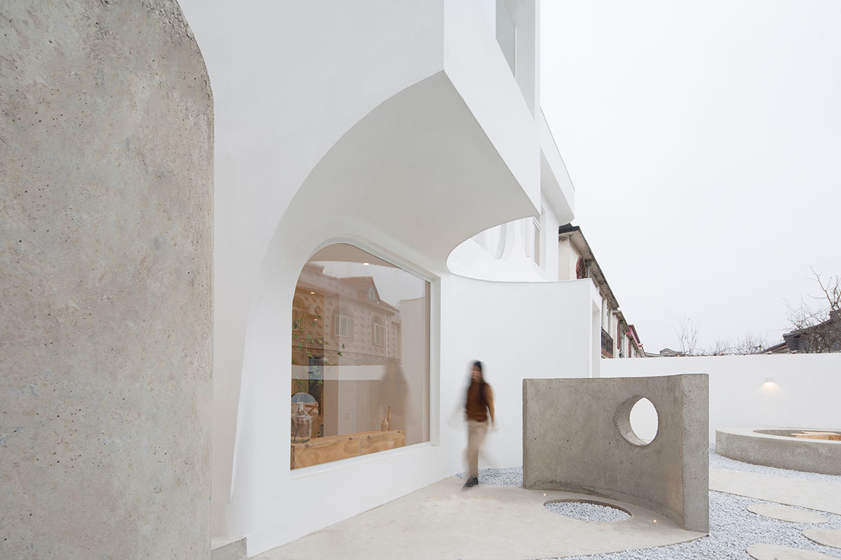 Boutique hotel by Atelier d'More is shaped by flowing curves and sculptural geometric compositions