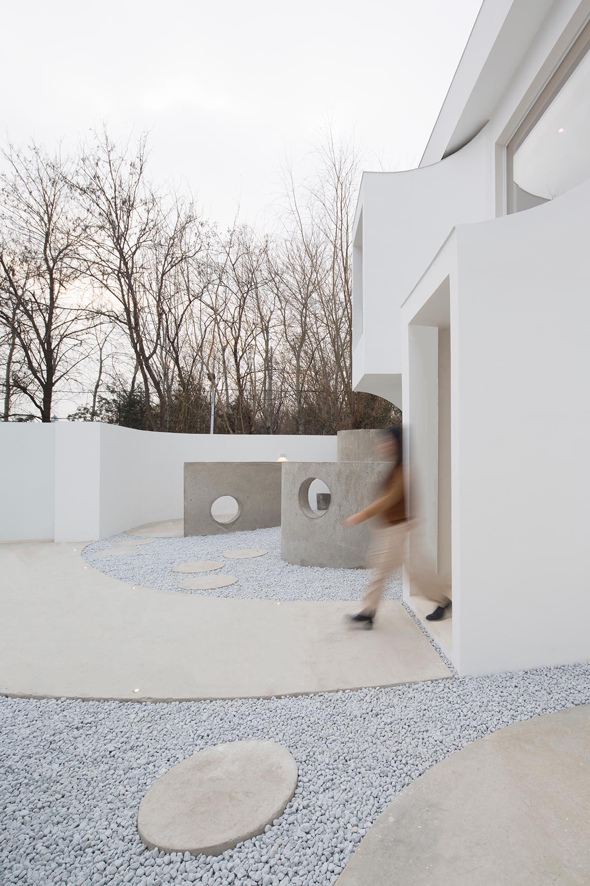 Boutique hotel by Atelier d'More is shaped by flowing curves and sculptural geometric compositions