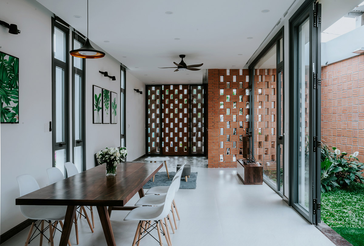 90odesign built this small house with brick walls as a shield of the house in Ho Chi Minh city