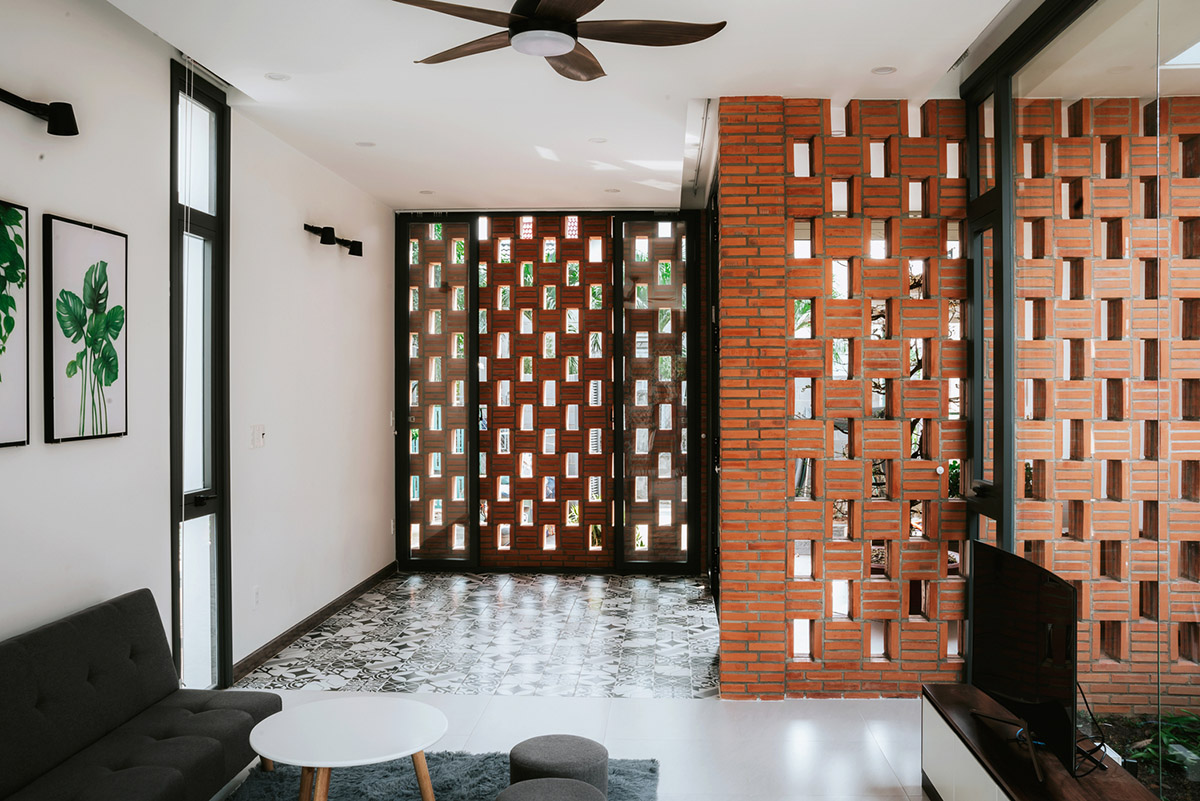 90odesign built this small house with brick walls as a shield of the house in Ho Chi Minh city