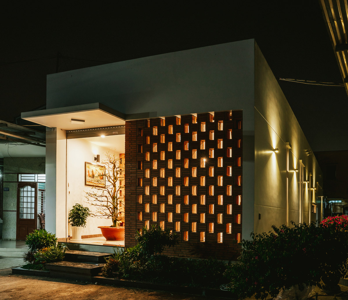 90odesign built this small house with brick walls as a shield of the house in Ho Chi Minh city