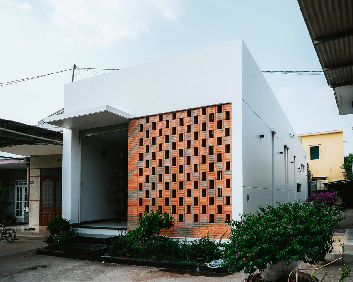 90odesign built this small house with brick walls as a shield of the house in Ho Chi Minh city
