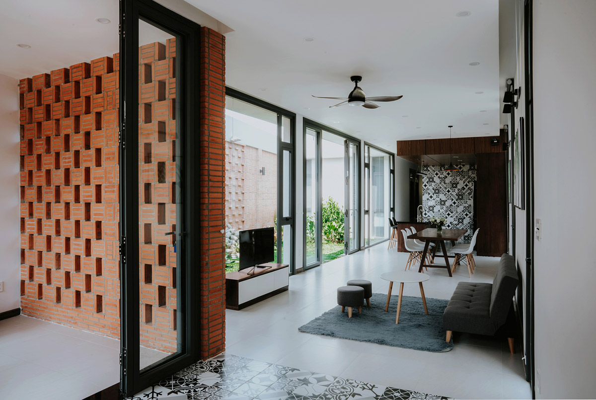90odesign built this small house with brick walls as a shield of the house in Ho Chi Minh city