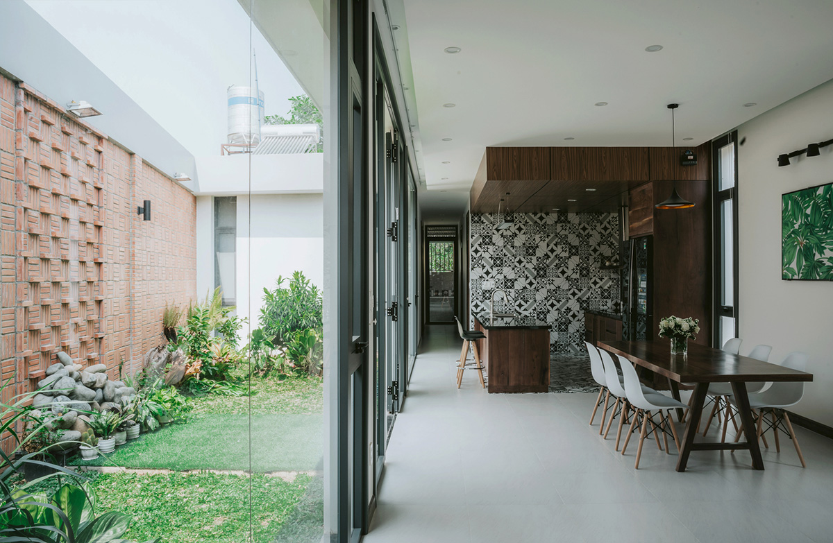 90odesign built this small house with brick walls as a shield of the house in Ho Chi Minh city