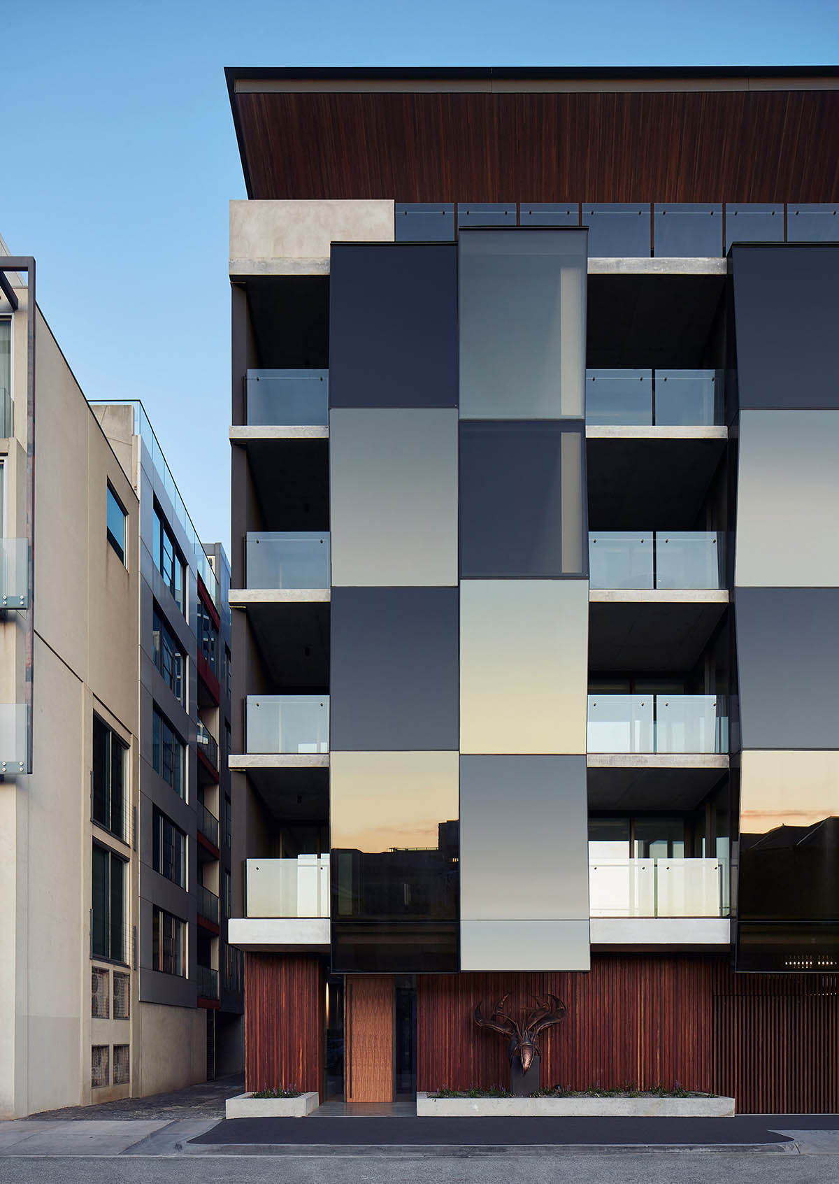 Wood Marsh's Alumuna Residences feature bronze folded mirrored glass in Australia