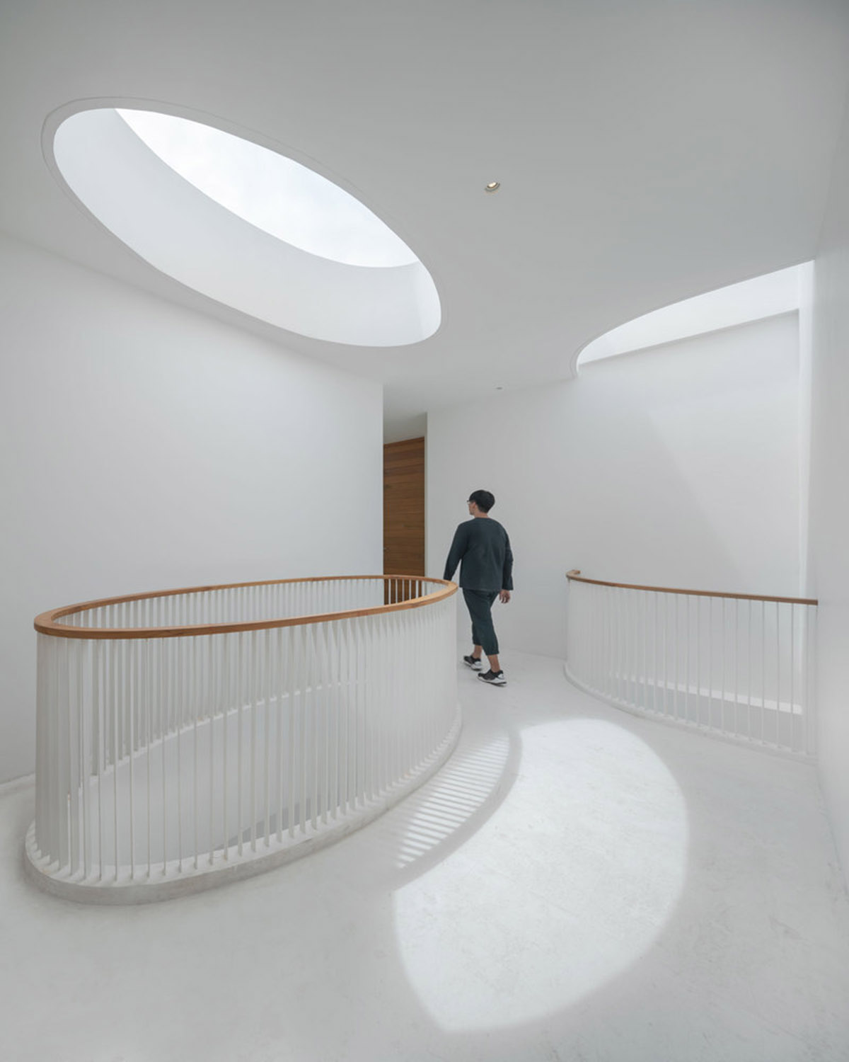 onion combines white concave and convex walls with colorful surfaces for beach resort in Thailand