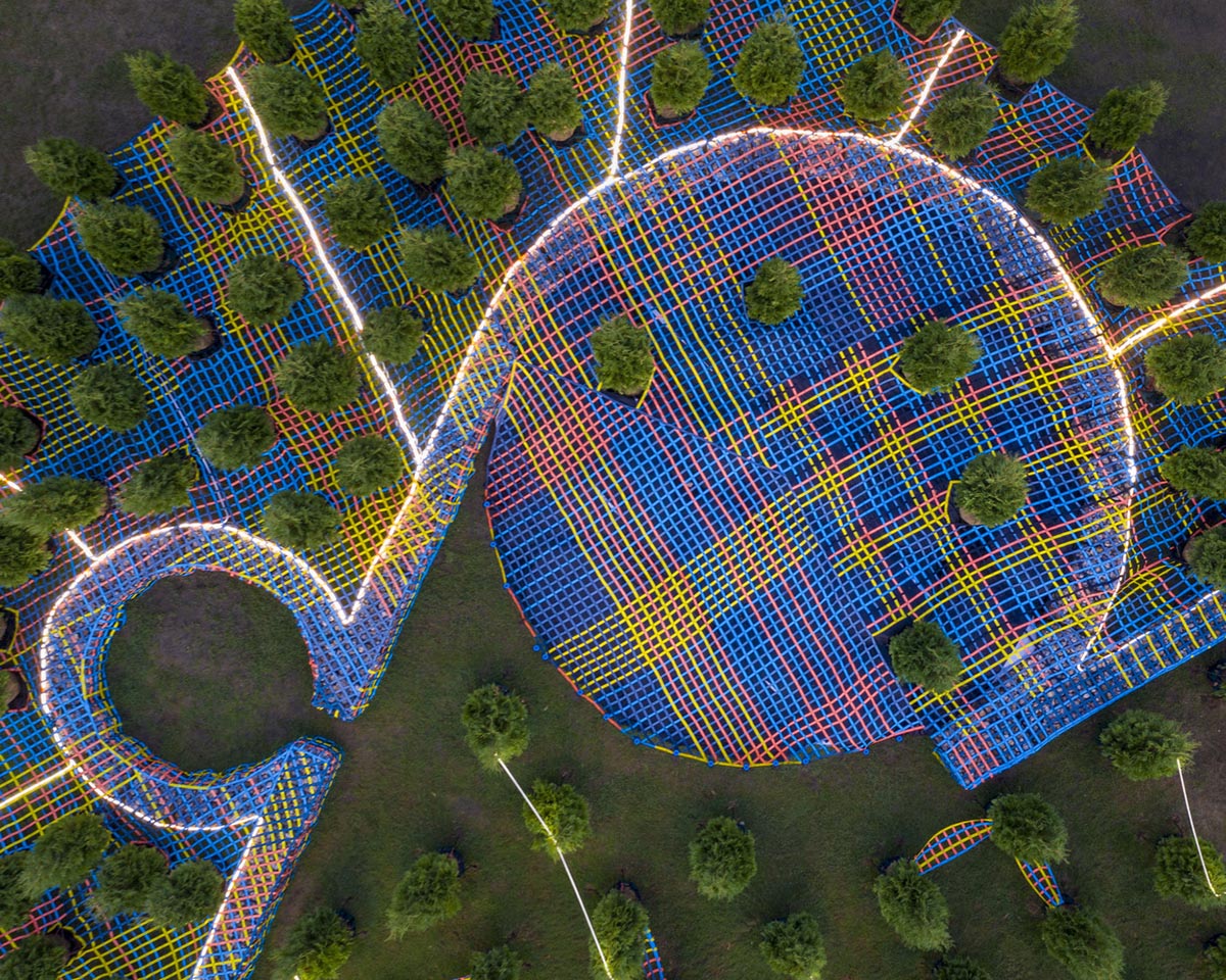 SO-IL wraps living trees with a hand-made nylon webbing in Columbus