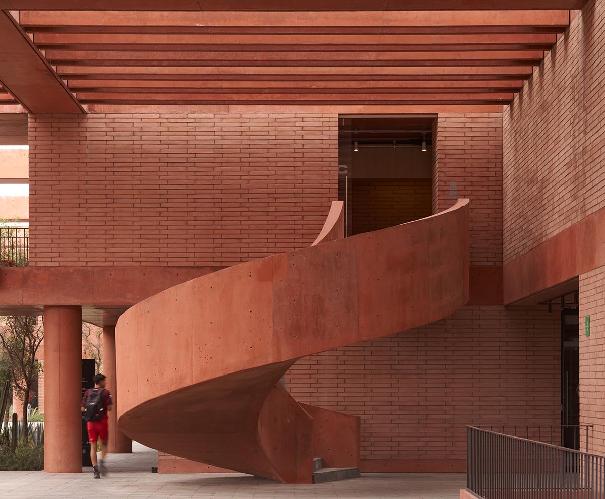 Red pigmented gridded structure defines village-like Mexican sport facility by Sordo Madaleno