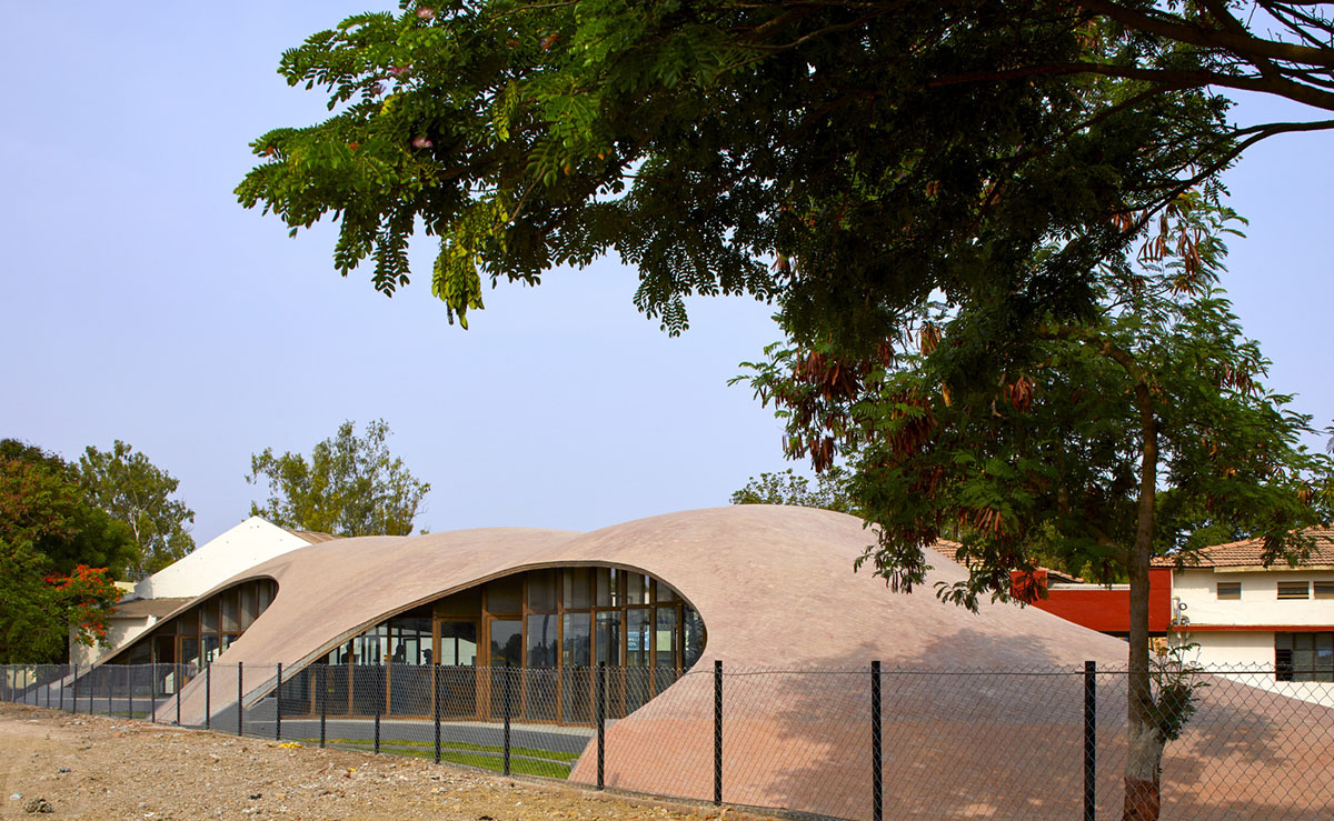 Sameep Padora & Associates built this children's library with curved brick roof in Maharashtra