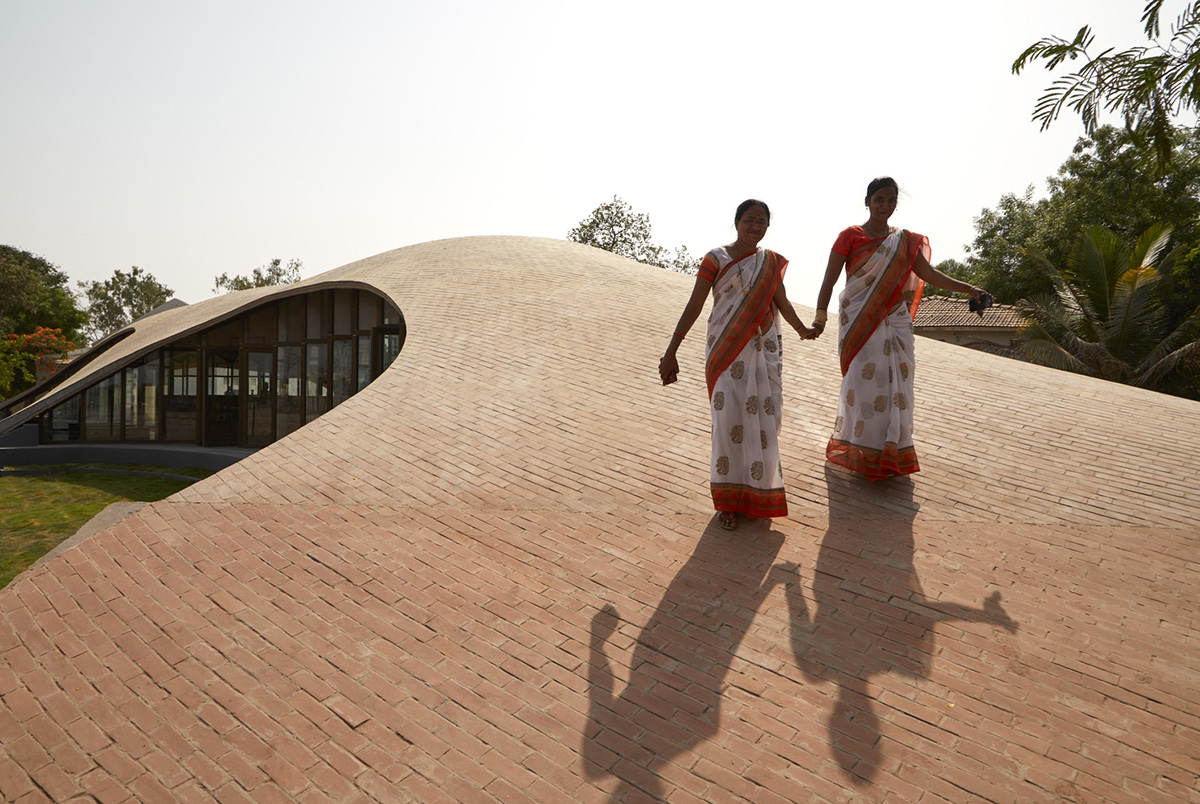 Sameep Padora & Associates built this children's library with curved brick roof in Maharashtra