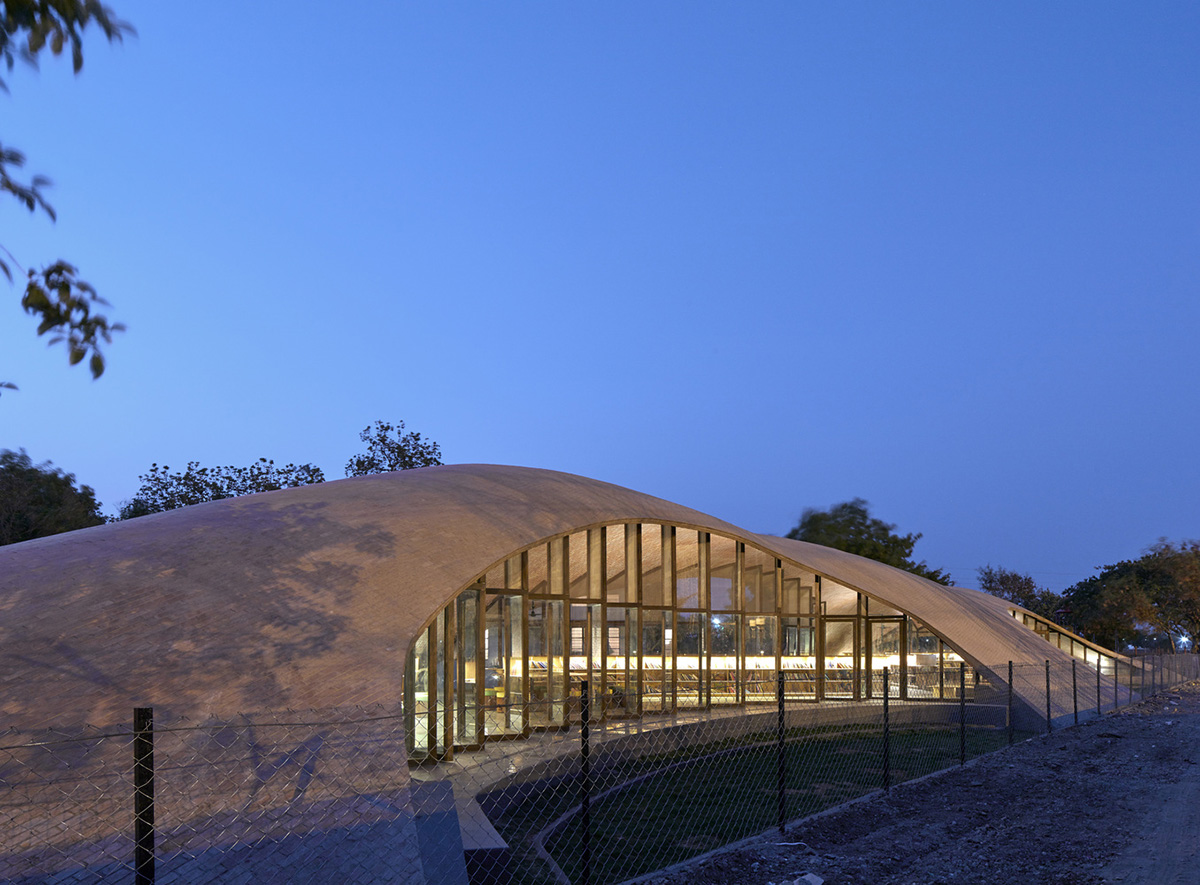 Sameep Padora & Associates built this children's library with curved brick roof in Maharashtra