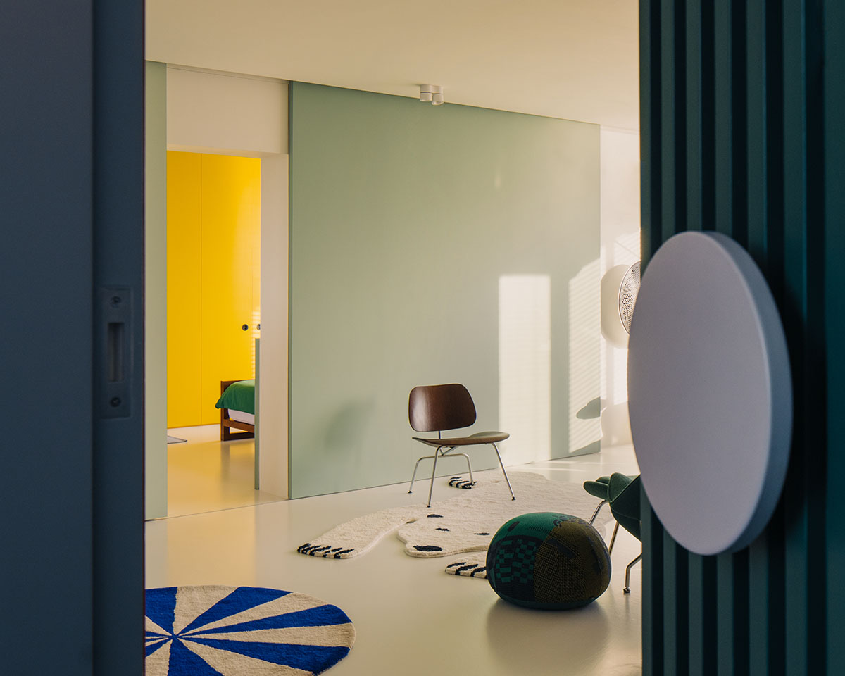 SPARK redesigns brutalist apartment with geometric and colorful objects in Singapore