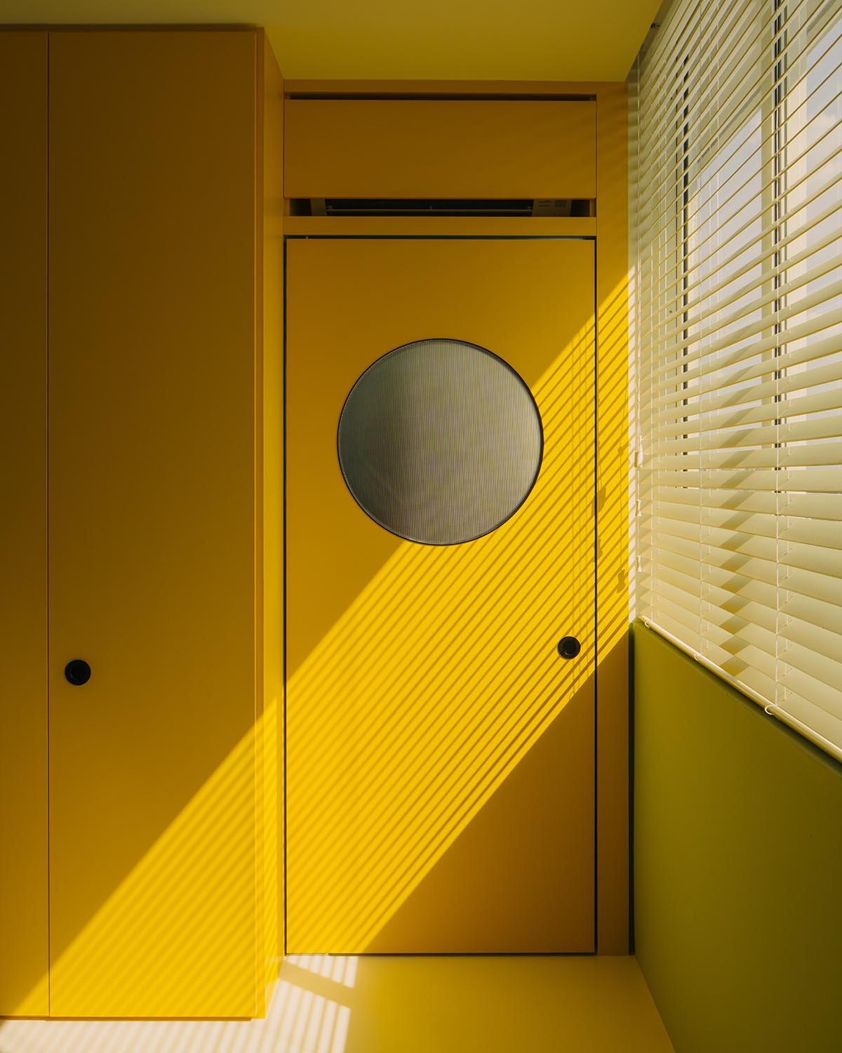 SPARK redesigns brutalist apartment with geometric and colorful objects in Singapore