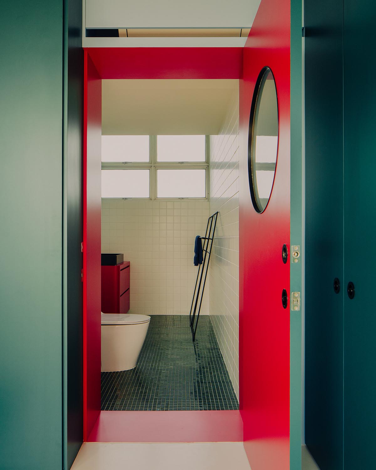 SPARK redesigns brutalist apartment with geometric and colorful objects in Singapore