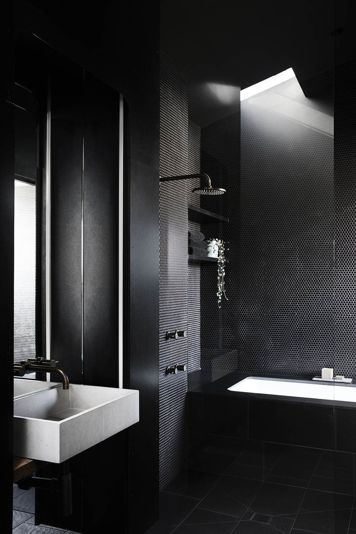 Splinter Society Architecture transforms old warehouse into a dark and moody home in Melbourne