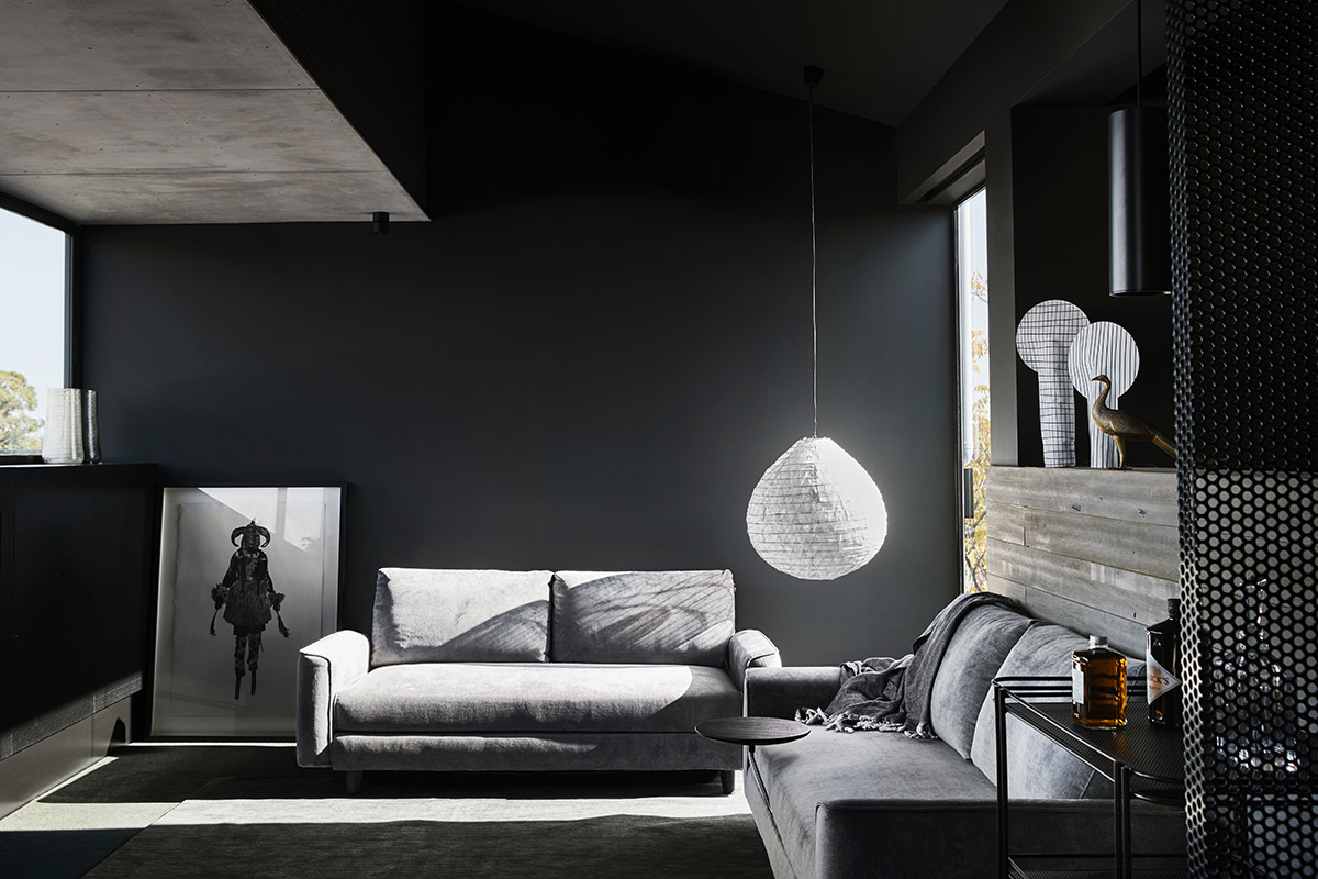 Splinter Society Architecture transforms old warehouse into a dark and moody home in Melbourne