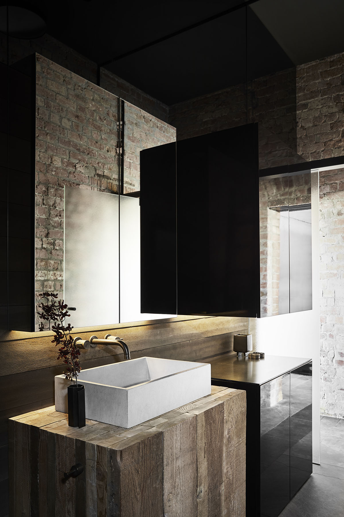 Splinter Society Architecture transforms old warehouse into a dark and moody home in Melbourne