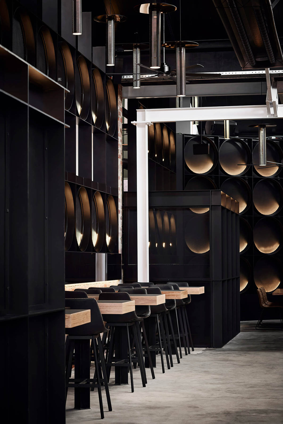 Splinter Society reflects the art of quality craft beer with dark tones within taproom in Glen Iris