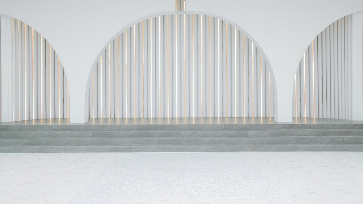 PHTAA creates flexible wedding venue with half-arch modular elements and white curved walls