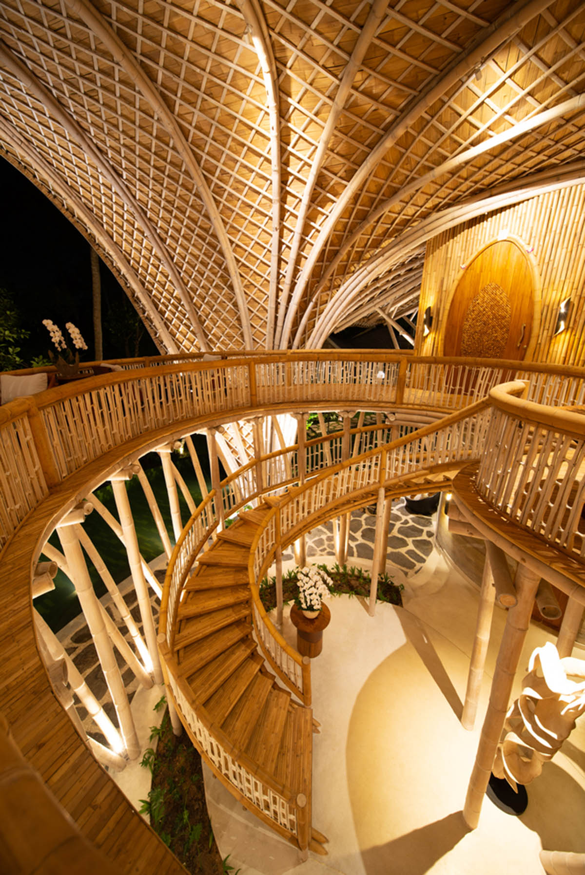Undulating bamboo roofs wrap this wellness retreat in a lush forest of Bali
