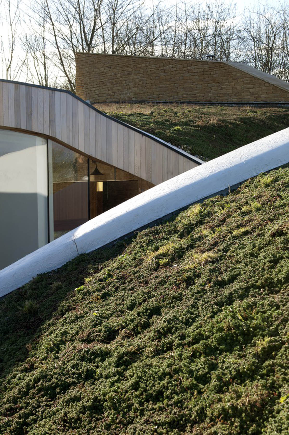 Featherstone Young creates meandering green roof for Stonecrop House in Rutland, UK