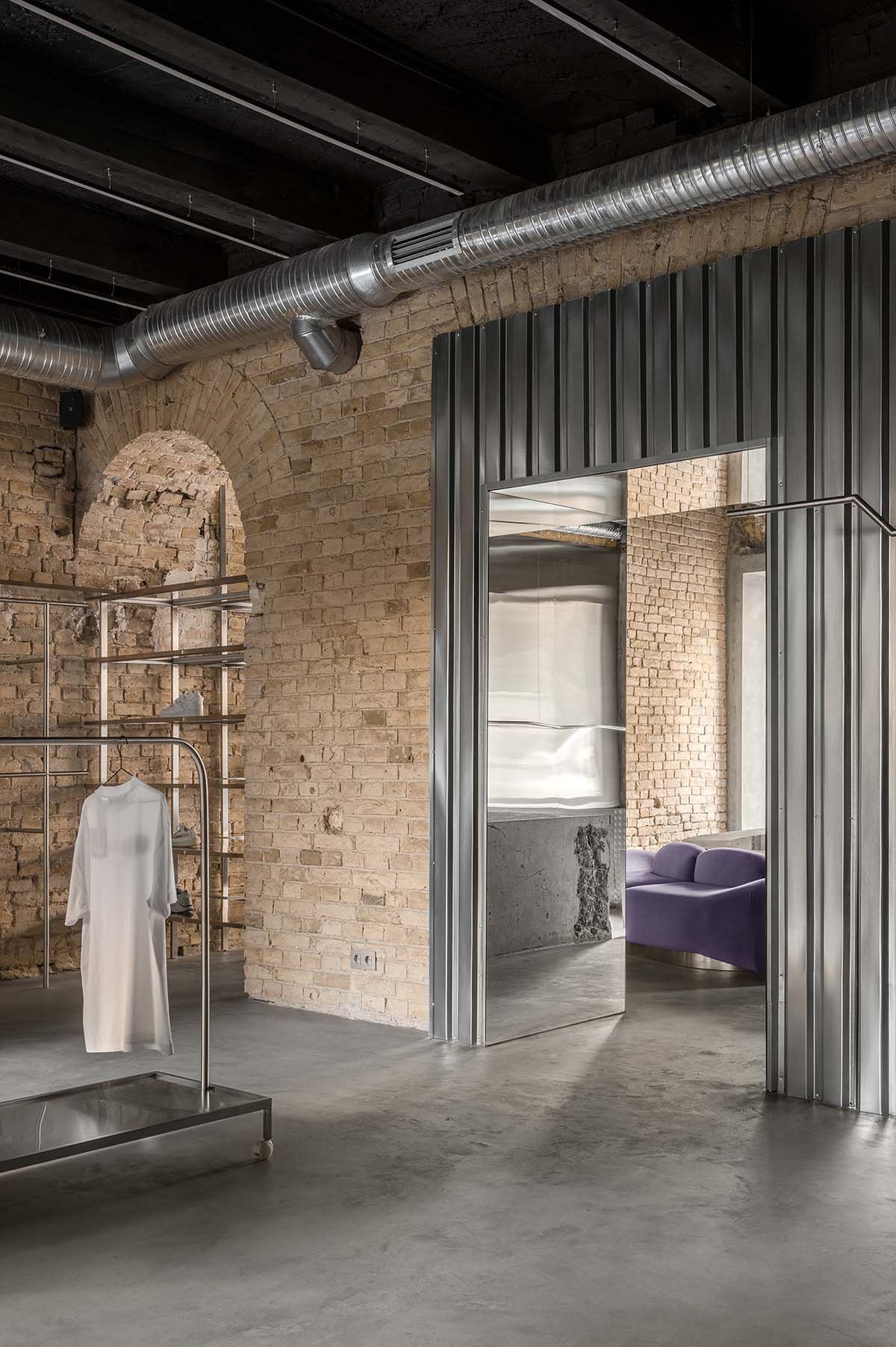 An early 20th-century building is transformed into a raw, industrial-looking interior for Kyiv store 