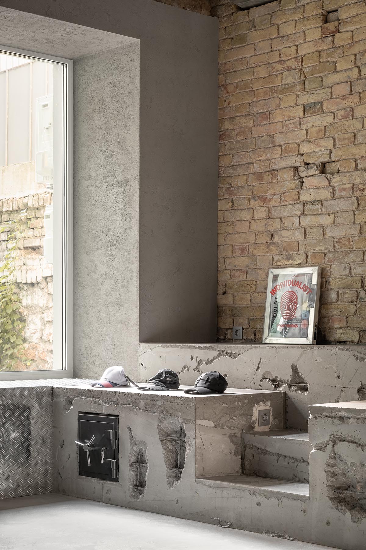 An early 20th-century building is transformed into a raw, industrial-looking interior for Kyiv store 